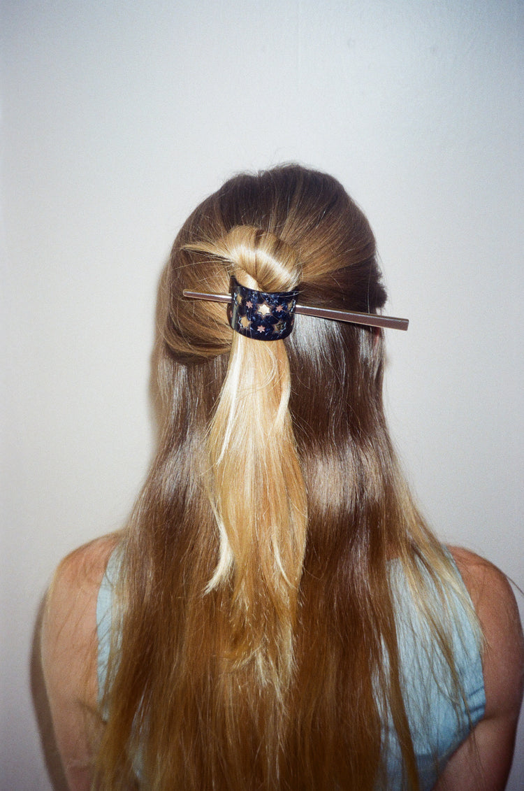 Cosmic Hair Knot Cover